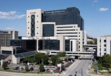 Large multi-story building with pedways across city street