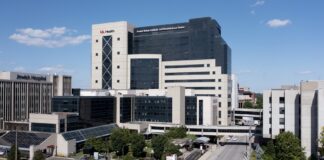Large multi-story building with pedways across city street