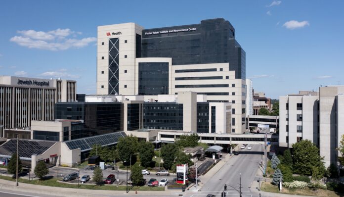 UofL Health - Frazier Rehab MED Large multi-story building with pedways across city street
