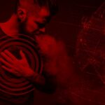 Illustration of man clutching his chest next to a graphic of a human heart.