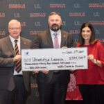 UofL Executive Vice President of Health Affairs Jeffrey Bumpous and UofL Health Interim CEO Jason Smith were presented with a check from the WHAS Crusade for Children President and CEO Dawn Lee on Sept. 17, 2025.