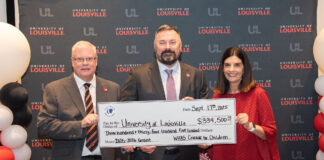 UofL Executive Vice President of Health Affairs Jeffrey Bumpous and UofL Health Interim CEO Jason Smith were presented with a check from the WHAS Crusade for Children President and CEO Dawn Lee on Sept. 17, 2025.