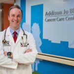 Man in white doctor's coat