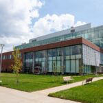 Four-story glass and brick classroom building