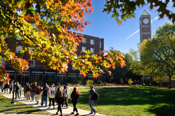 UofL Fall General Students walking across campus in the fall.