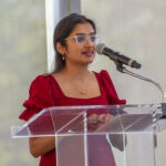 Student speaks into a microphone