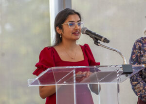 Student speaks into a microphone