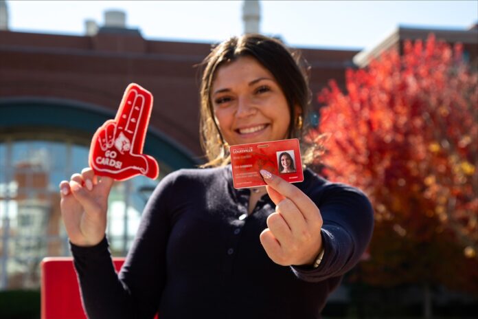 Cardinal Card_reduced Student holds red Cardinal Card.