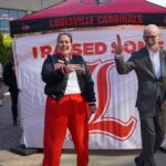 Amanda James, alumni relations specialist, with President Gerry Bradley on Raise Some L on Oct. 22.