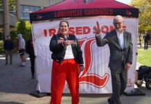 Raise Some L 2025 unites Cardinals, raising $2.9M for UofL Amanda James, alumni relations specialist, with President Gerry Bradley on Raise Some L on Oct. 22.