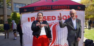 Raise Some L 2025 unites Cardinals, raising $2.9M for UofL Amanda James, alumni relations specialist, with President Gerry Bradley on Raise Some L on Oct. 22.