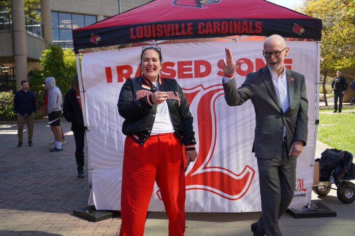 Amanda James and President Bradley Amanda James, alumni relations specialist, with President Gerry Bradley on Raise Some L on Oct. 22.