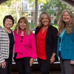 UofL oncology social work expert leads national effort to transform cancer patient support Four social workers at a training at Boston University