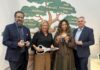 UofL Envirome Institute partners to expand youth mental health education Humana, Jewish Heritage Fund, UofL launch Well-being Center at JA Finance Park Two men and two women with oversized scissors and ceremonial keys standing in front of a wall mural of a tree with mental health tips