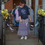 Person cuts a paper chain