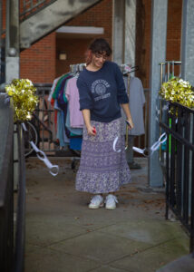 Person cuts a paper chain