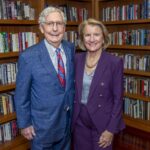 West Virginia’s first elected female senator speaks at UofL’s McConnell Center Man and woman stand in a library with shelves of books behind them.