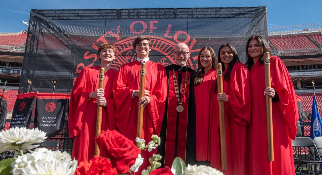 Students with Gerry Bradley with floral arrangement.