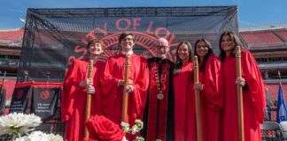 Students with Gerry Bradley with floral arrangement.