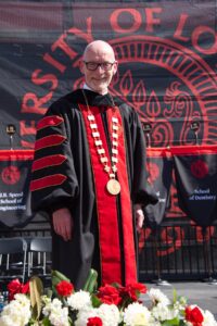 Gerry Bradley wears robe and presidential medallion