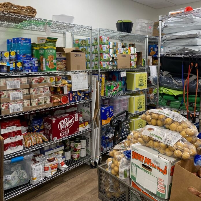 Cardinal Cupboard The shelves in the Cardinal Cupboard, a free food pantry on campus for all students, faculty, and staff.