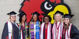 UofL graduates in commencement regalia.