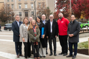 Group of people with blue canister.