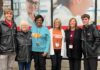 Group of staff and students together in front of the UofL Ambulatory Care Building.