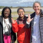 Two students and a professor in Northern Malawi.