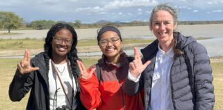 Two students and a professor in Northern Malawi.