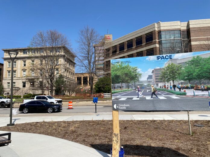 Conceptual rendering with street and buildings behind it