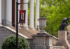 U.S. News ranks UofL audiology, multiple others among top graduate programs The Thinker Statue In the Springtime with a Here & Beyond Banner in the foreground