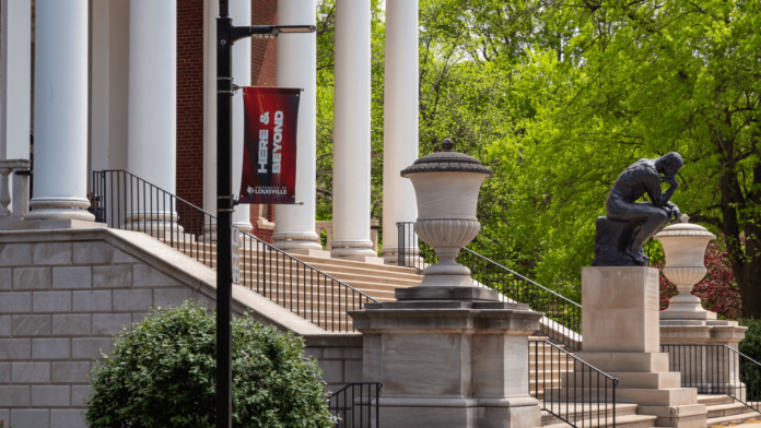 Thinker Statue The Thinker Statue In the Springtime with a Here & Beyond Banner in the foreground