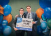 UofL student team wins intercollegiate pitch competition Two male students hold a sign announcing their $15,000 win in a student competition