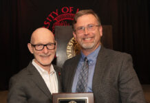 University of Louisville President Gerry Bradley (left) presents Aaron Calhoun with the 2026 UofL Trustees Award.