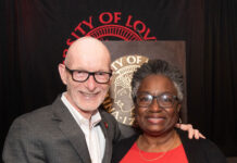 UofL President Gerry Bradley presents Diane Whitlock with the 2026 George Howe Distinguished Staff Award at the 2026 President's Excellence Awards Dinner.