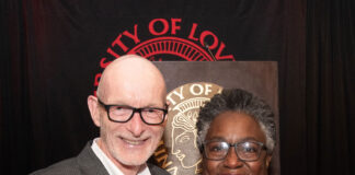 UofL President Gerry Bradley presents Diane Whitlock with the 2026 George Howe Distinguished Staff Award at the 2026 President's Excellence Awards Dinner.