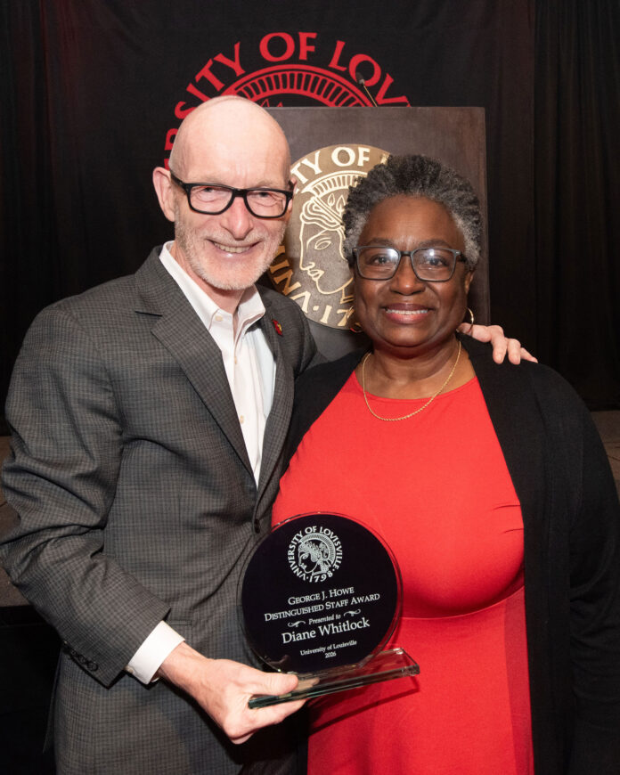 UofL President Gerry Bradley presents Diane Whitlock with the 2026 George Howe Distinguished Staff Award at the 2026 President's Excellence Awards Dinner.