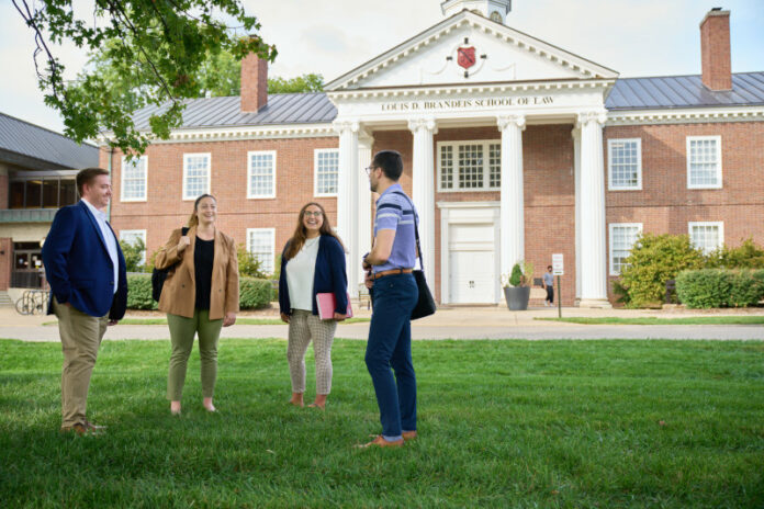 Here_and_Beyond_Campaign Students talking on the lawn outside the Brandeis School of Law.
