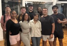 UofL students use AI to create software tools and companies A group of college students in an indoor area