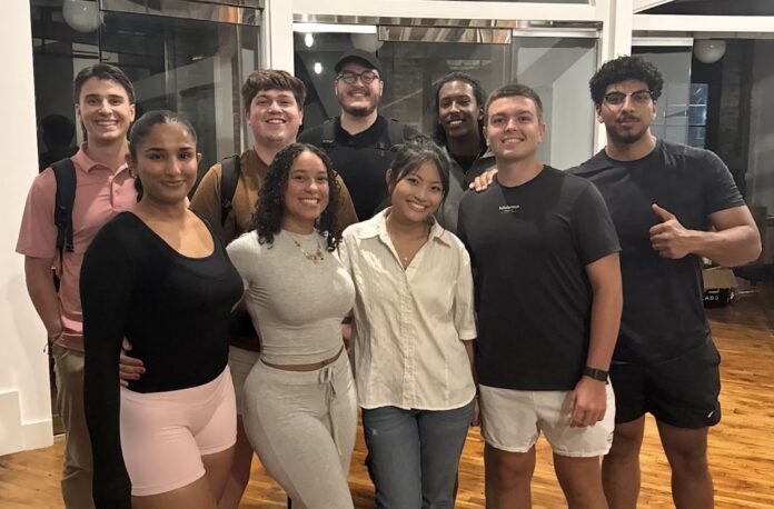 A group of college students in an indoor area