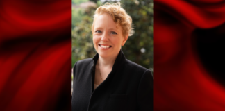 Woman in black jacket set within a red template frame