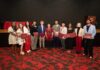 UofL students land prestigious awards across the globe for 2025–26 Students smile while holding awards and honors cords at a reception