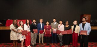 UofL students land prestigious awards across the globe for 2025–26 Students smile while holding awards and honors cords at a reception