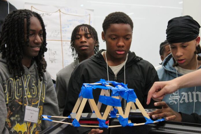CR photo 1 rev Cardinals Rising students Jeffery Durham, Aaron Bradford Jr, Malakhai Pettigrew and Jamaal Haskins participate in a building project as part of the Cardinals Rising summer camp 2026.