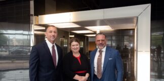 UofL receives $11.6 million to amplify research in nutrition and metabolic health Two men in business suits and a woman in a black dress with red trim.