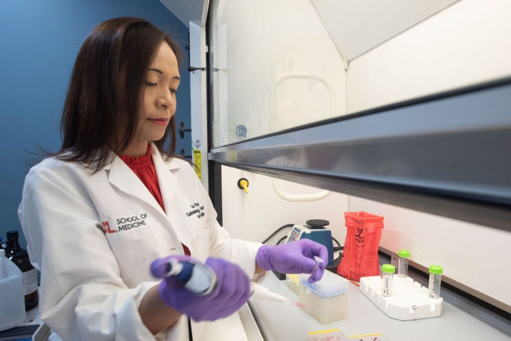 Woman at laboratory hood.