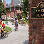 Pedal with the Provost kicks off Cards Commuter Challenge Provost and Cardinals bike out of Amelia Place's drive way/