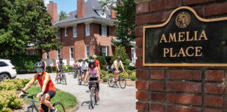 Pedal with the Provost kicks off Cards Commuter Challenge Provost and Cardinals bike out of Amelia Place's drive way/
