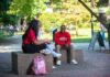 Students talking together on campus.